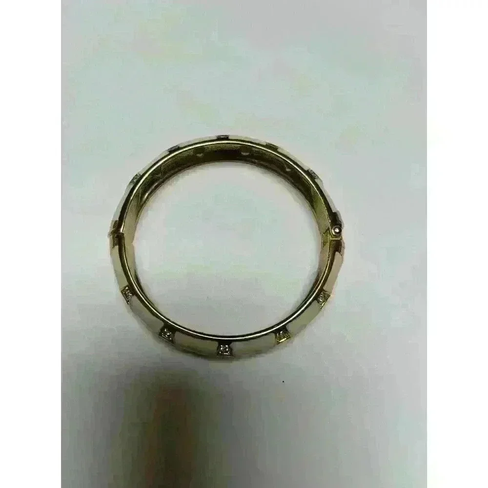 White enamel‎ bracelet with gold/rhinestone accents